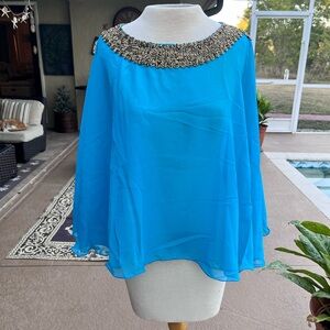 Elegant Blue Women's Top with Embellished Neckline